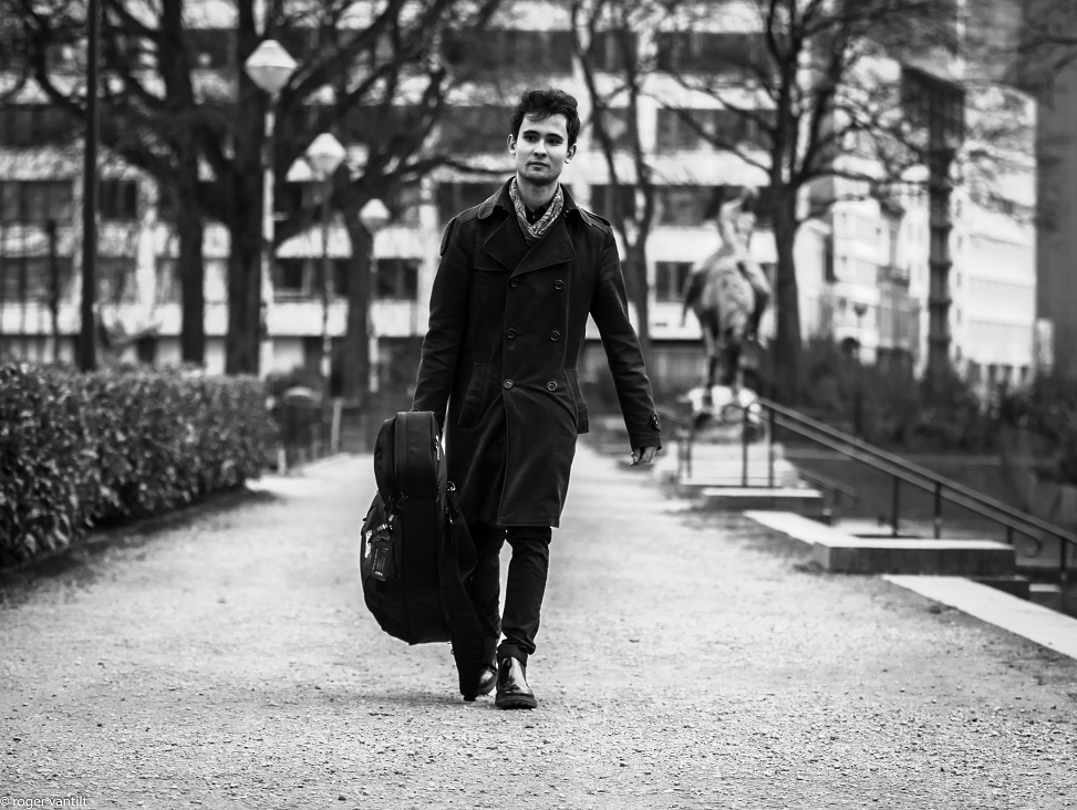 Matteo with a Guitar walking in