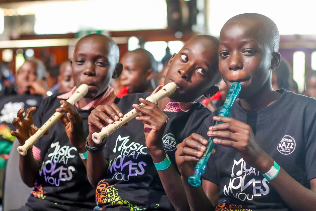 Three Ghetto Classics children playing recorder